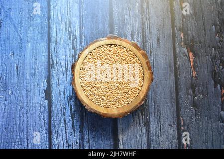 Raw whole dried wheat cereal grains Stock Photo