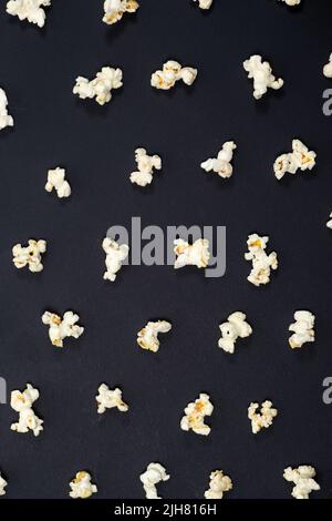 Popcorn on an black background, close-up view from above Stock Photo