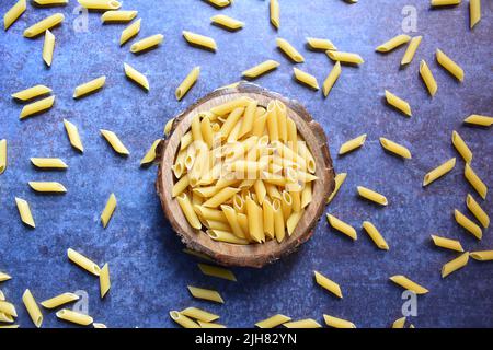 Whole dried Penne rigate pasta Stock Photo