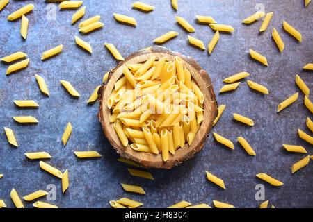 Whole dried Penne rigate pasta Stock Photo