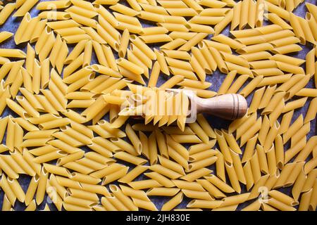 Whole dried Penne rigate pasta Stock Photo