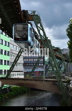 Wuppertal, Nordrhein-Westfalen, Germany - 15.July 2022 The suspended monorail called 'Schwebebahn' in Wuppertal, is an icon symbol of the town and mar Stock Photo