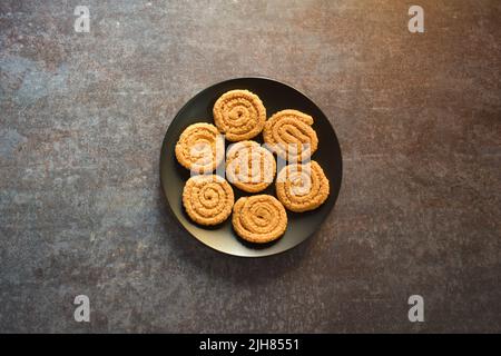 Chakli fried Indian traditional savory snack food Stock Photo