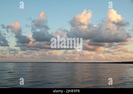 Clouds during sunset on a beach Stock Photo