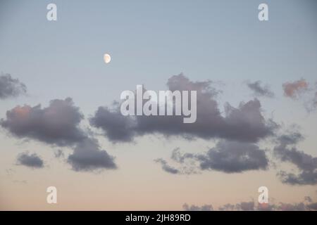 Clouds during sunset on a beach Stock Photo