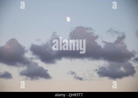 Clouds during sunset on a beach Stock Photo