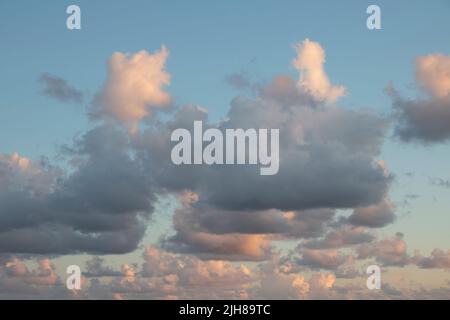 Clouds during sunset on a beach Stock Photo