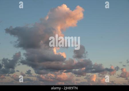 Clouds during sunset on a beach Stock Photo