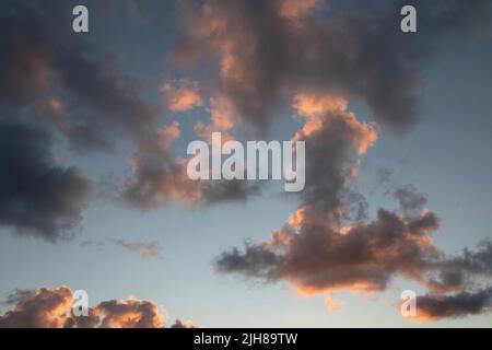 Clouds during sunset on a beach Stock Photo