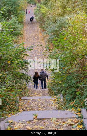 Walk on the stairs in the autumn park. View from above. Stock Photo