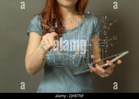 A woman holding a tablet and touching a global network render Stock Photo