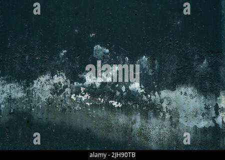 Dark green colored concrete wall with damp stain, grunge texture Stock Photo