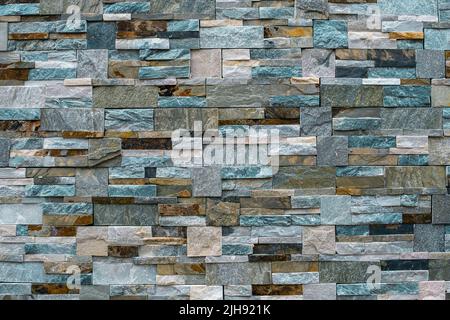 Rustic stone mosaic wall facing ceramic porcelain tiles stonewear Stock Photo