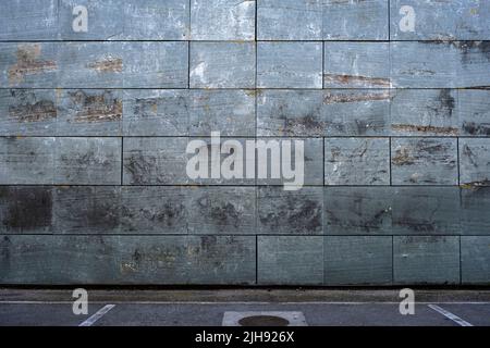 Slate effect porceliain tiles wall cladding in a parking lot , architecture detail background Stock Photo