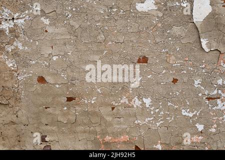 Old weathered wall with worn out plaster, grunge background Stock Photo
