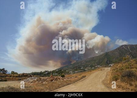 Wildfire in the Sierra de Mijas with a huge smoke column. 18 july 2022, Mijas, Andalucia, Spain. Stock Photo