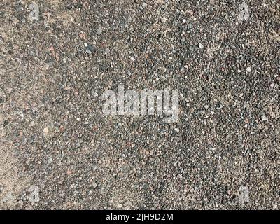Texture of pebbles, gravel, urban road surface, soil surface.  Stock Photo