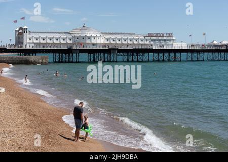Brighton, East Sussex, UK - July 15, 2022 : View of the beach and pier in Brighton on July 15, 2022. Unidentified people Stock Photo