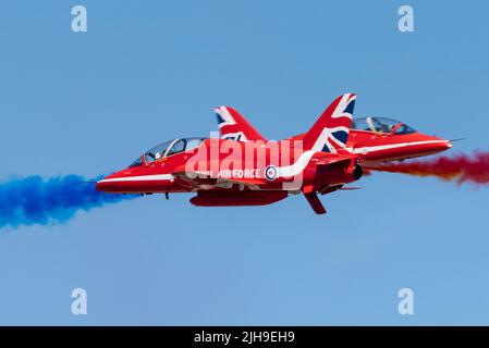 RAF Fairford, Gloucestershire, UK. 16th Jul, 2022. One of the world’s largest airshows has returned after a 3 year break due to the covid pandemic bringing international air forces, display teams and huge crowds to the Cotswolds. RAF Red Arrows Synchro Pair performing an opposition pass Stock Photo