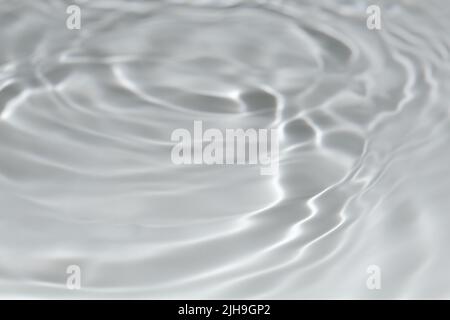 Light gray transparent clear calm water surface texture with splashes, waves and bubbles. Trendy abstract nature background with shadows and lights Stock Photo