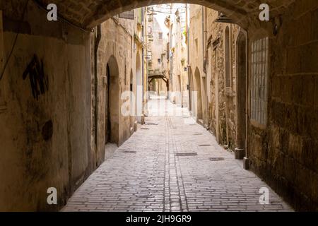 Old paved street in the small town of Sommière in the Gard, South of France Stock Photo