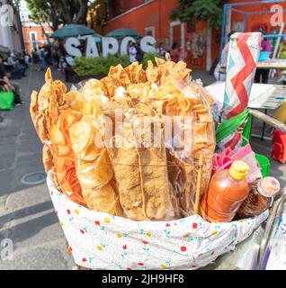 homameade street food potato chips and 'chicharrines' at sale of a peddler at 'Barrio de Los Sapos'neighborhood district market in Puebla city, Mexico Stock Photo