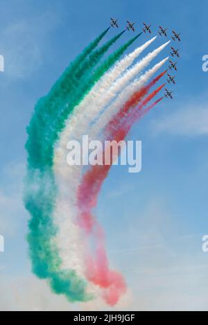 RAF Fairford, Gloucestershire, UK. 16th Jul, 2022. One of the world’s largest airshows has returned after a 3 year break due to the covid pandemic bringing international air forces, display teams and huge crowds to the Cotswolds. Italian Air Force Frecce Tricolori display team flying the Italian flag colours in smoke trail Stock Photo