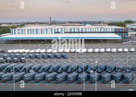 Top view of Amazon Prime electric delivery vans, parked at  the logistics hub of Amazon. Turin, Italy - July 2022 Stock Photo