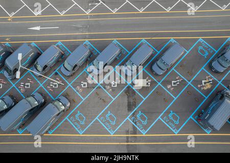 Top view of Amazon Prime electric delivery vans, parked at  the logistics hub of Amazon. Turin, Italy - July 2022 Stock Photo