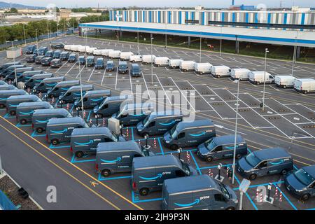 Top view of Amazon Prime electric delivery vans, parked at  the logistics hub of Amazon. Turin, Italy - July 2022 Stock Photo