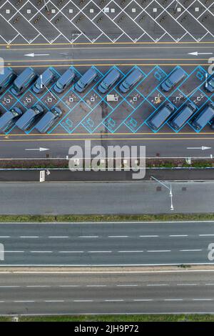 Top view of Amazon Prime electric delivery vans, parked at  the logistics hub of Amazon. Turin, Italy - July 2022 Stock Photo