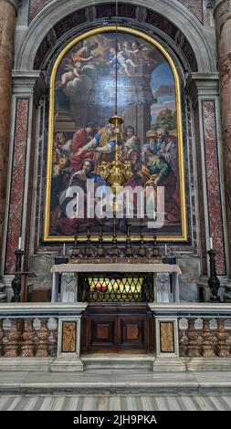 A vertical shot of a religious painting in the Papal Basilica of Saint Peter in Vatican Stock Photo