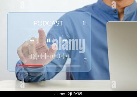Businessman finger touch  virtual screen digital podcast. Technology internet online Concept. Stock Photo