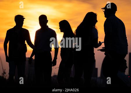 London, UK. 16th July, 2022. UK Weather: Heatwave sunset from the top of Greenwich Park as the UK's temperature rise continues with an amber alert for extreme heat is in place; Britain could soon experience its hottest day. Credit: Guy Corbishley/Alamy Live News