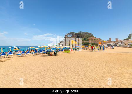 The sandy Platja Gran beach at the resort town of Tossa de Mar, Spain, on the Costa Brava coast of the Mediterranean Sea. Stock Photo