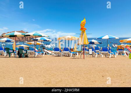 The sandy Platja Gran beach at the resort town of Tossa de Mar, Spain, on the Costa Brava coast of the Mediterranean Sea. Stock Photo