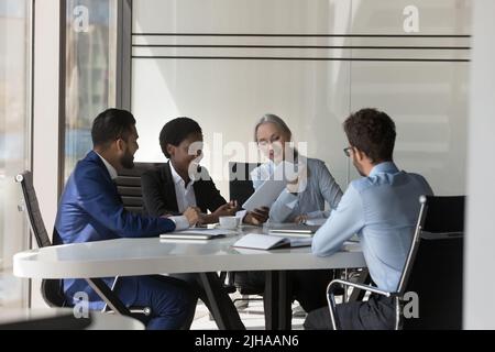 Different aged diverse HR team interviewing job candidate Stock Photo