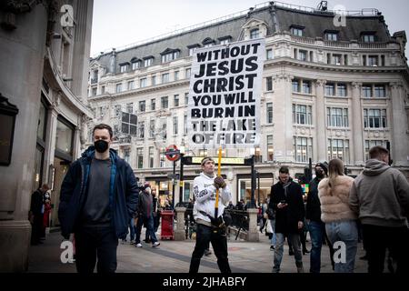 Christian banner in central London Oxford St  “ Without Jesus Christ you will burn in the lake of fire” Stock Photo