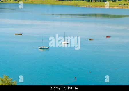 Tbilisi sea and boat with deflated sails. Landscape Stock Photo