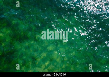 Top view of the blue sea surface. Taken on the open sea from above. Stock Photo