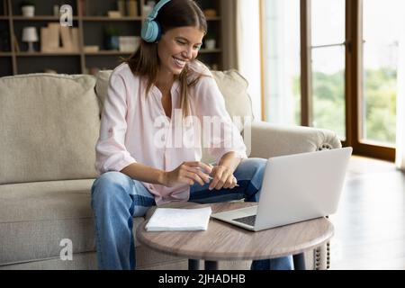 Pretty student woman studying at home use laptop Stock Photo