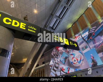 Flight Information Board. Hamad International Airport Departure lounge Stock Photo