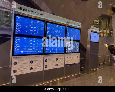 Flight Information Board. Hamad International Airport Departure lounge Stock Photo