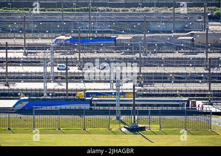 Eurotunnel Shuttle UK Kent Cheriton terminal platforms loading & unloading coaches cars lorries to special drive on off carriages operated by Getlink Stock Photo