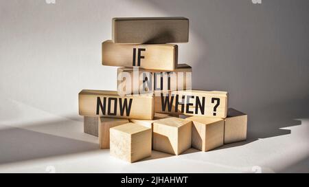 If not now then when symbol on wooden blocks and white background. Copy space. Business and motivational quote concept. Stock Photo