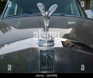 View of Exclusive Luxury Rolls Royce Silver shadow 1975 car limousine parked in city. Front with 'Spirit of Ecstasy' bonnet ornament sculpture. Stock Photo