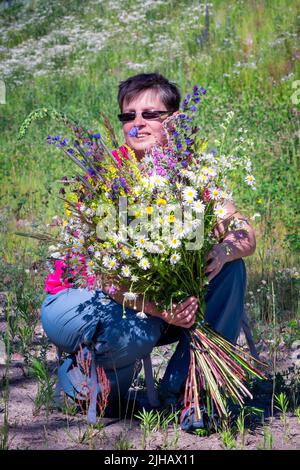 Chamomile bunch, meadow field flowers bouquet in crystal