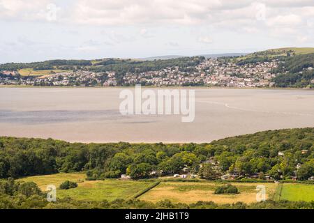 A view of Grange Over Sands across the river Kent estuary from above Arnside, in Cumbria, England, UK Stock Photo