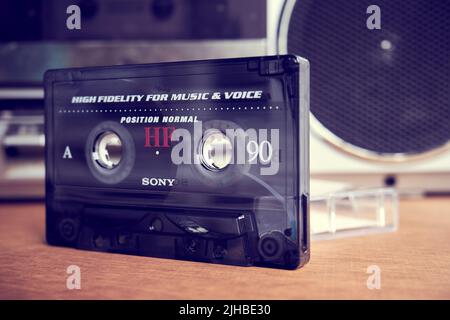 Sony audio cassette in front of a tape recorder Stock Photo