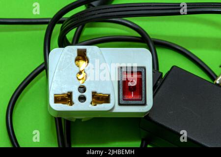 Universal electric travel adapter plug with a switch Stock Photo